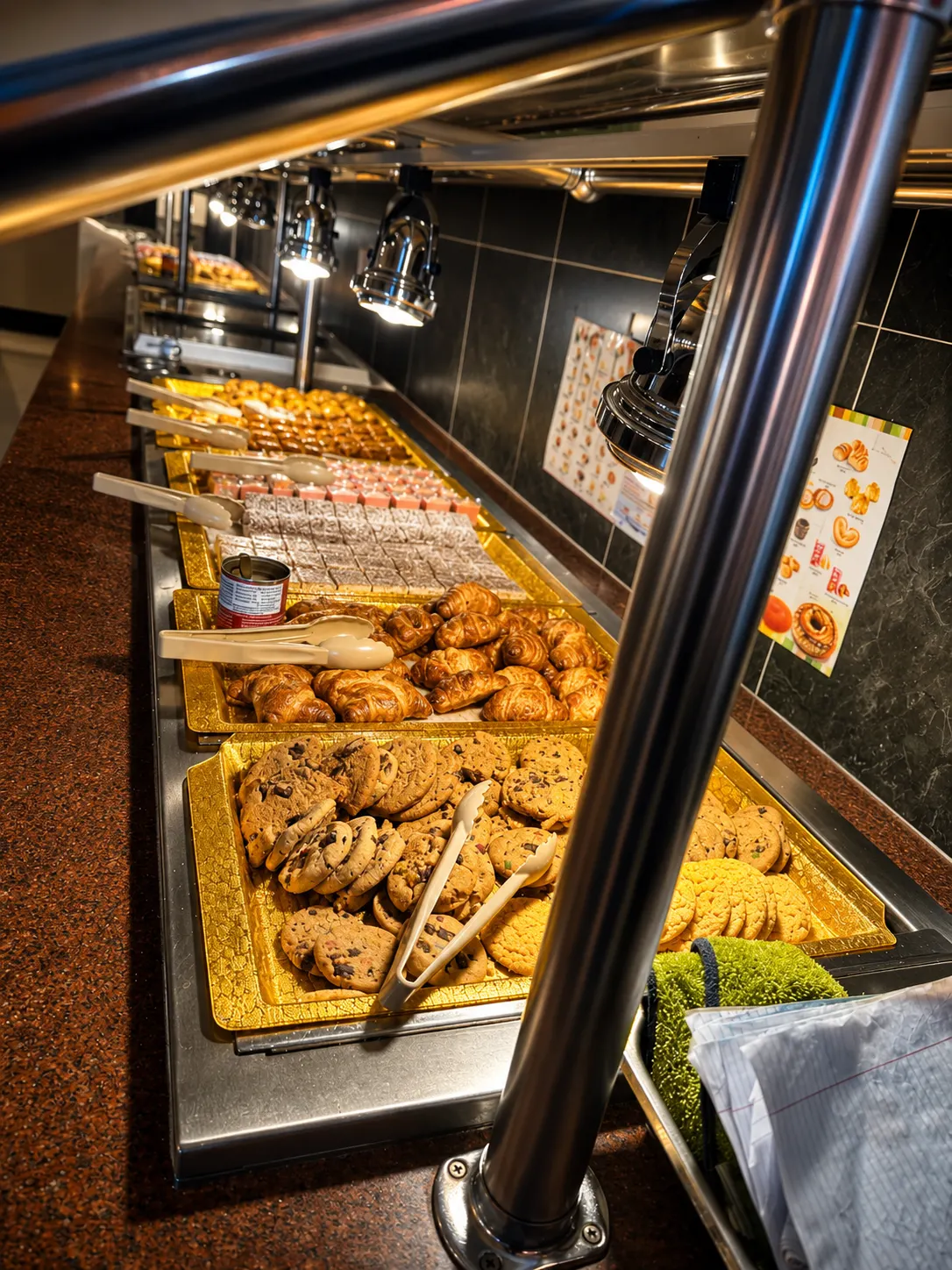 Dessert bar at Best Buffet & Grill lined with fresh-baked cookies, croissants, and pastries